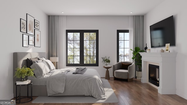 bedroom with dark hardwood / wood-style floors