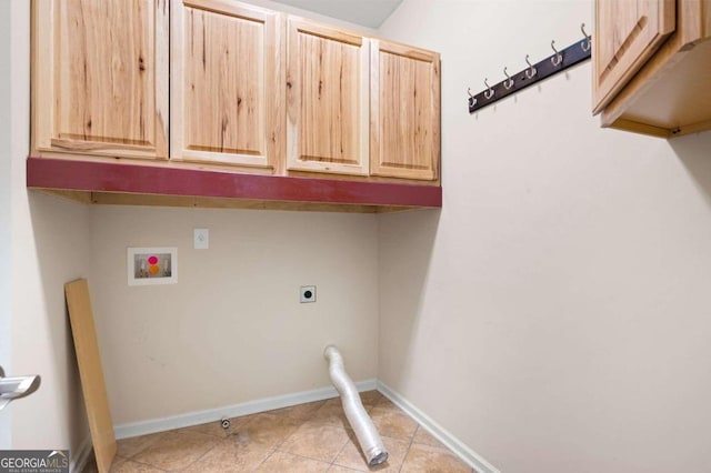 laundry area with cabinets, washer hookup, hookup for an electric dryer, and light tile floors