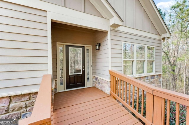 property entrance featuring a wooden deck