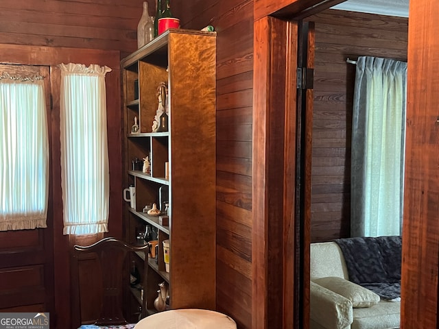 bathroom featuring wood walls