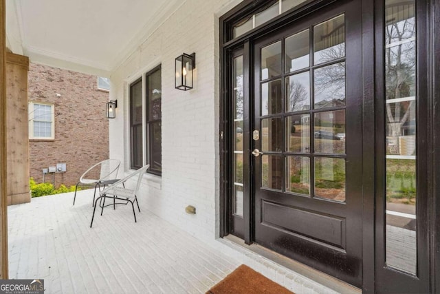 property entrance featuring covered porch