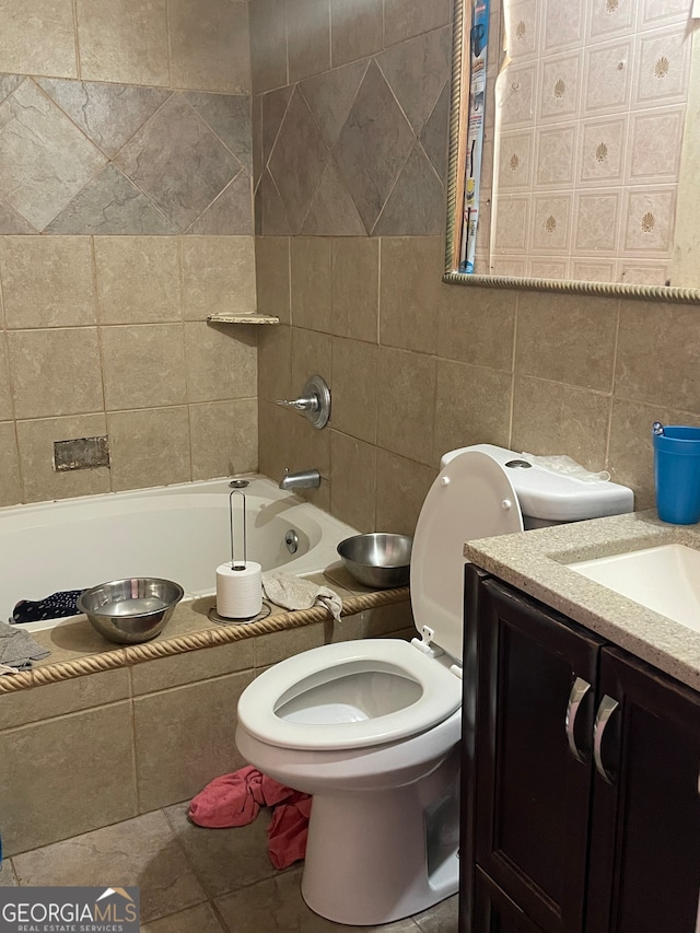 full bathroom with tile walls, oversized vanity, toilet, and tile floors