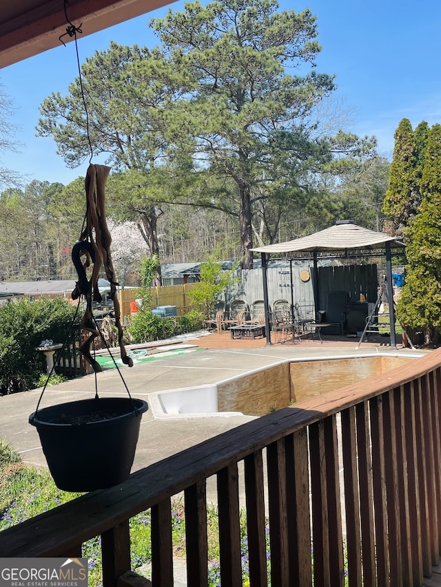 exterior space featuring a gazebo, a pool, and a patio