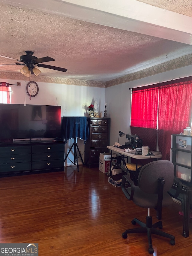 office space with ceiling fan, a textured ceiling, and dark hardwood / wood-style flooring