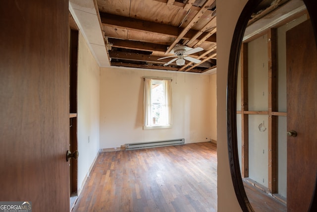 interior space featuring wood ceiling, baseboard heating, ceiling fan, and hardwood / wood-style flooring