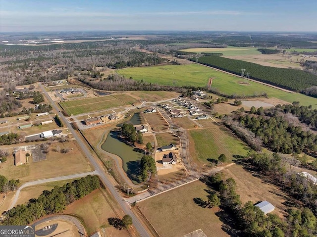 aerial view with a rural view and a water view