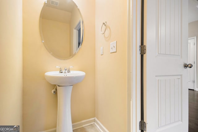 bathroom featuring hardwood / wood-style flooring