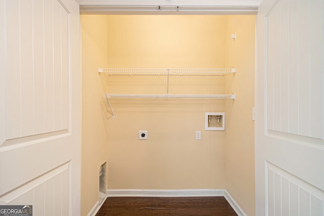 clothes washing area featuring hookup for a washing machine, hookup for an electric dryer, and dark wood-type flooring