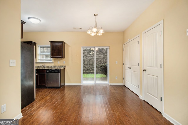 kitchen with an inviting chandelier, pendant lighting, dark wood-type flooring, and dishwasher