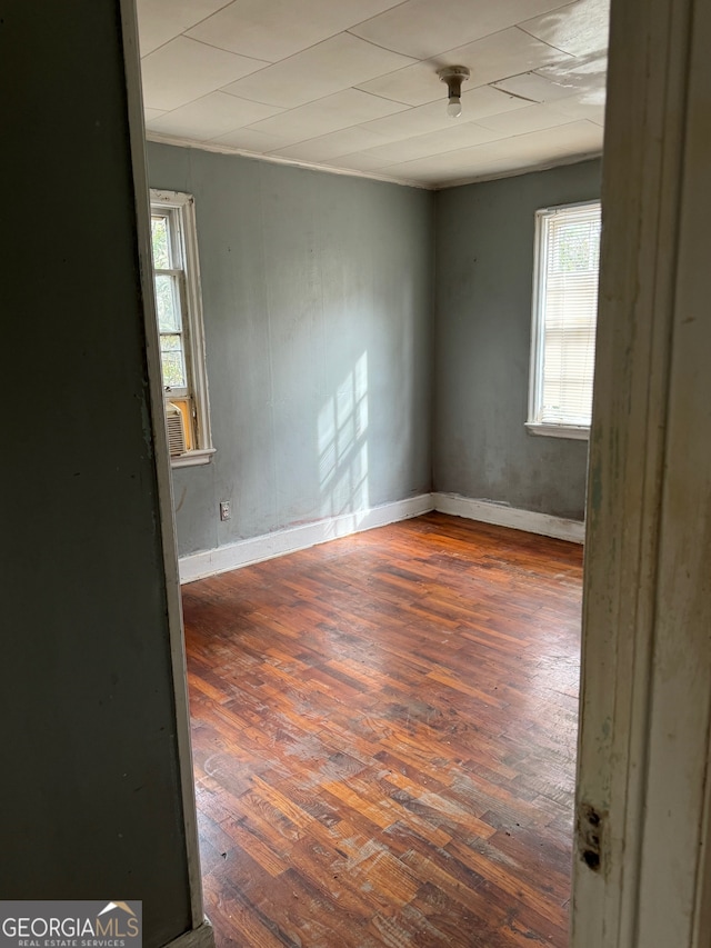 empty room featuring dark wood-type flooring