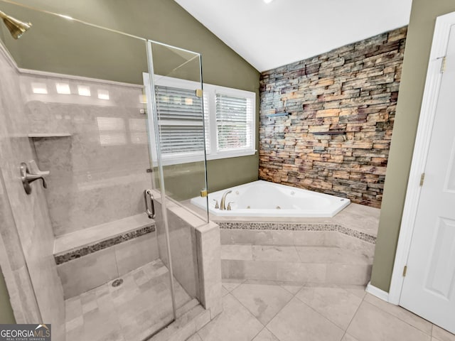 bathroom with tile flooring, plus walk in shower, and vaulted ceiling