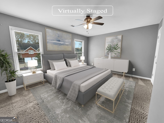 carpeted bedroom featuring ceiling fan