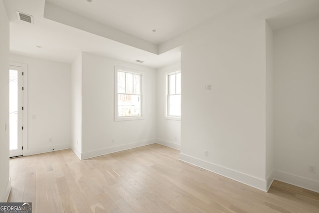 empty room with light hardwood / wood-style floors