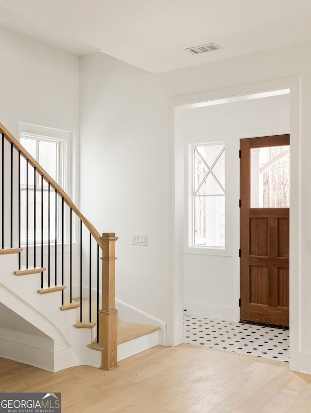 entryway with wood-type flooring