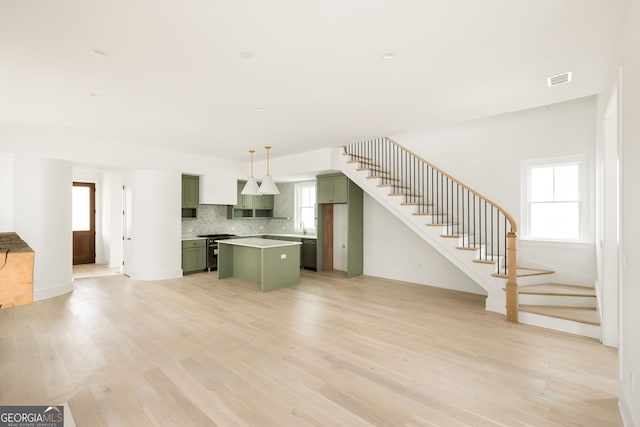 unfurnished living room featuring light wood-type flooring