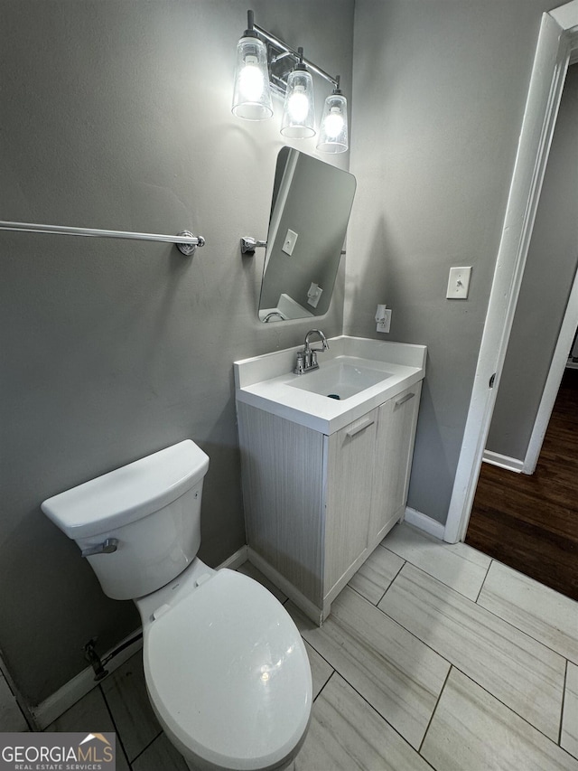 bathroom with vanity and toilet