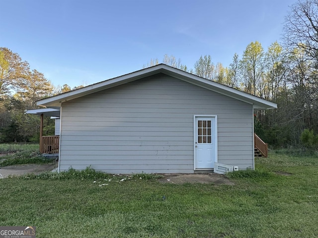 view of side of home featuring a yard