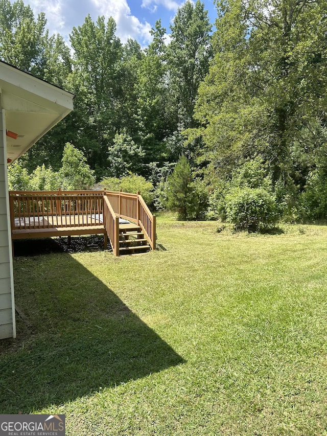 view of yard featuring a deck