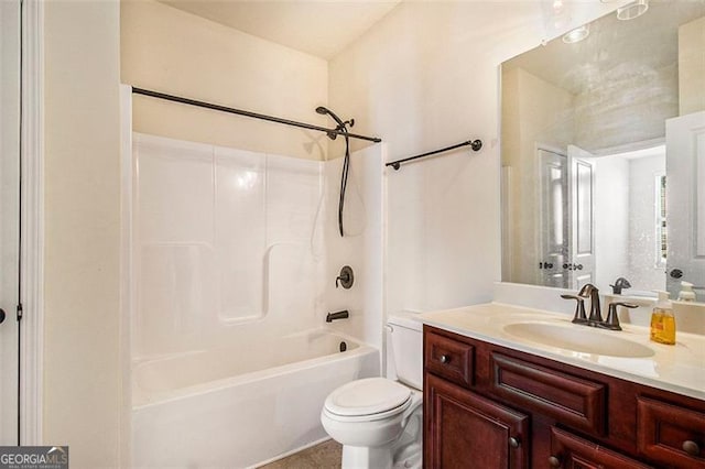 full bathroom featuring vanity,  shower combination, and toilet