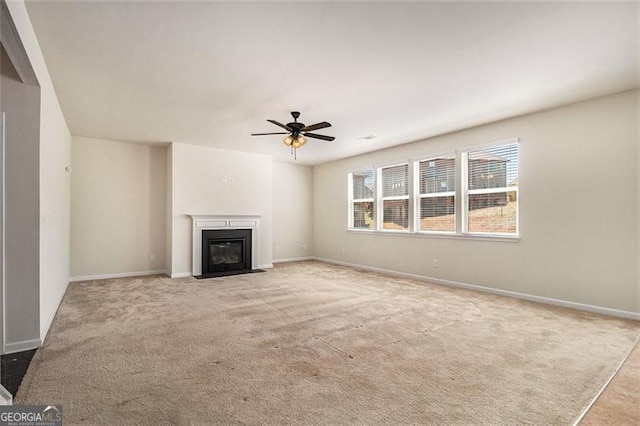 unfurnished living room with ceiling fan and light colored carpet