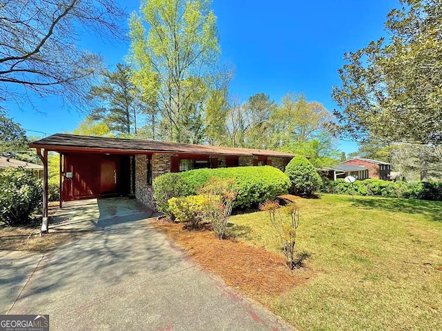 ranch-style home with a carport and a front lawn