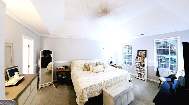 bedroom with ornamental molding, multiple windows, and carpet floors