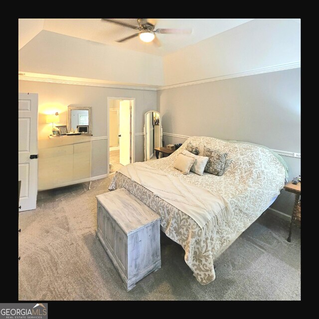 bedroom with carpet floors, vaulted ceiling, and ceiling fan