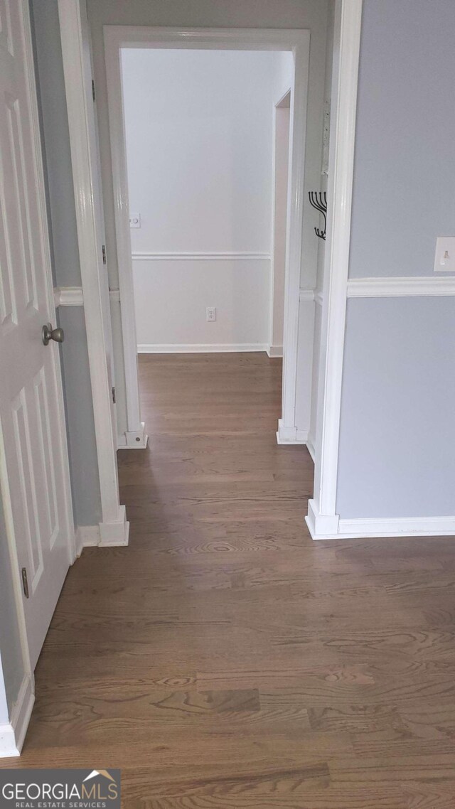 hallway featuring dark hardwood / wood-style flooring