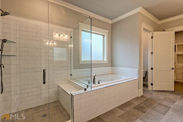 bathroom featuring separate shower and tub, tile floors, and toilet