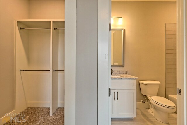 full bathroom featuring  shower combination, toilet, and vanity