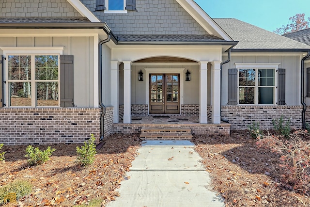 property entrance with french doors and covered porch