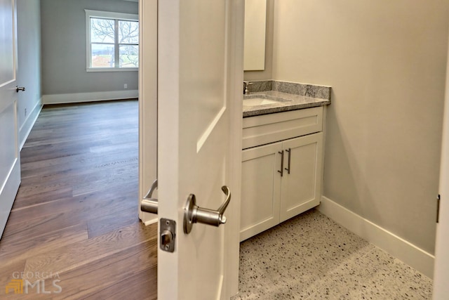 bathroom featuring vanity and hardwood / wood-style floors