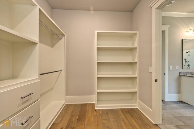 spacious closet with tile flooring