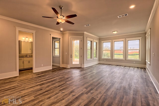 unfurnished living room with dark hardwood / wood-style floors, crown molding, and ceiling fan