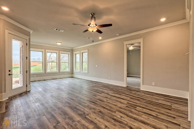 empty room featuring dark hardwood / wood-style flooring, ceiling fan, and crown molding