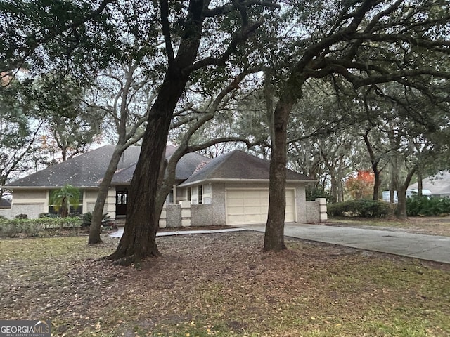 ranch-style home featuring a garage