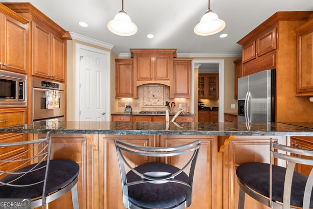 kitchen featuring a kitchen breakfast bar, decorative light fixtures, and stainless steel appliances