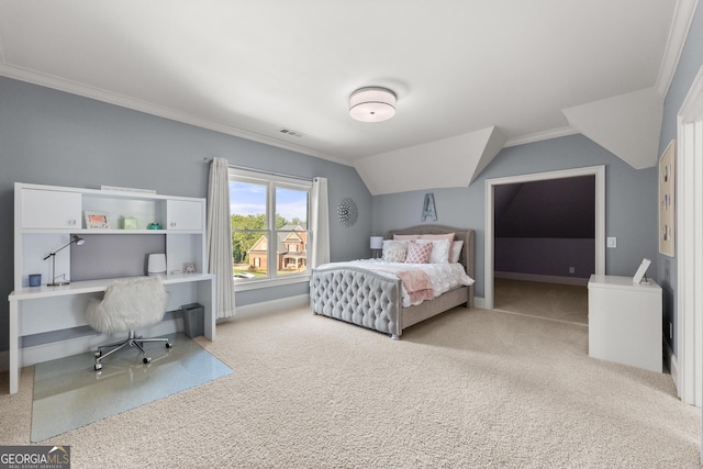 carpeted bedroom featuring ornamental molding and vaulted ceiling