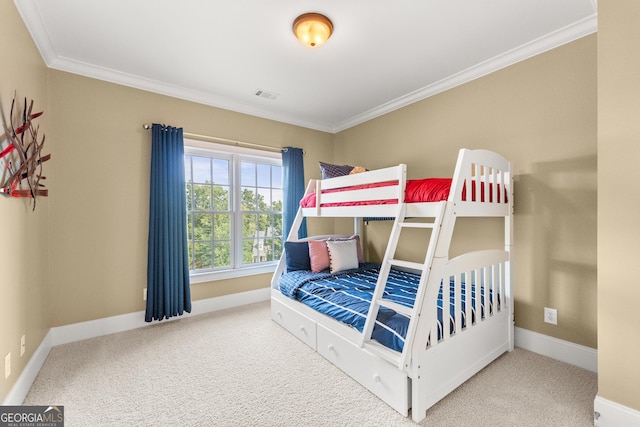 bedroom with carpet flooring and crown molding