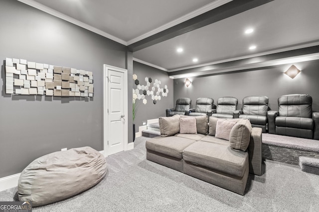 carpeted home theater featuring crown molding