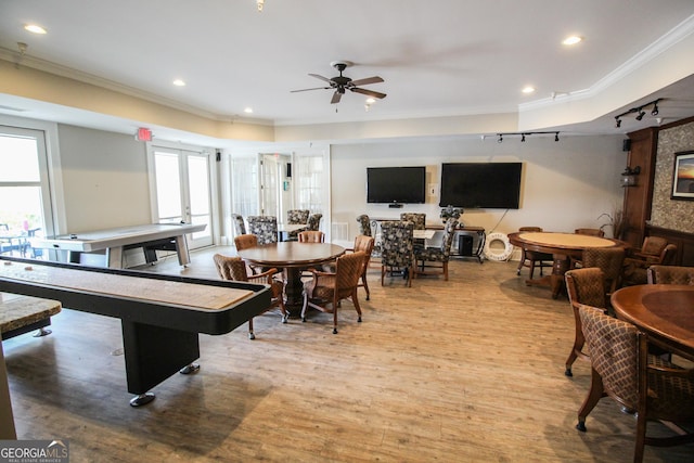 dining space featuring hardwood / wood-style floors, plenty of natural light, ceiling fan, and crown molding