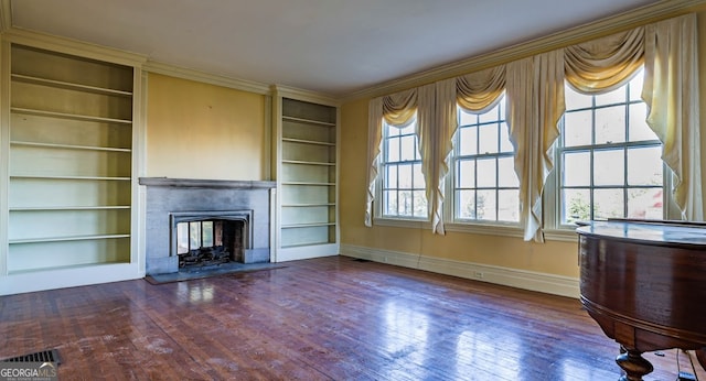 unfurnished living room with built in features and dark hardwood / wood-style flooring