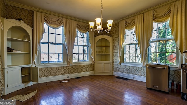 unfurnished dining area featuring dark hardwood / wood-style flooring and a healthy amount of sunlight