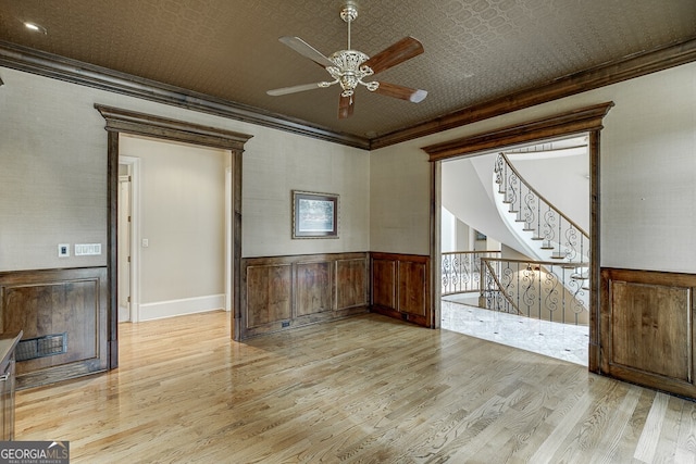 empty room featuring ceiling fan and light wood-type flooring