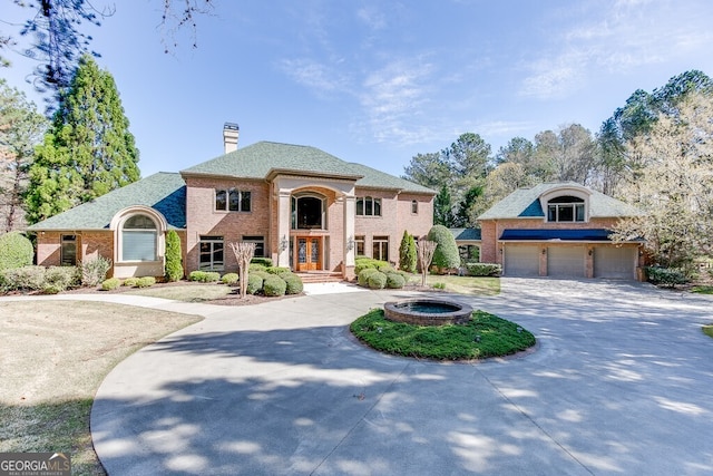 french country inspired facade with a garage