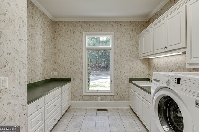 laundry room with sink, crown molding, washer / dryer, light tile flooring, and cabinets