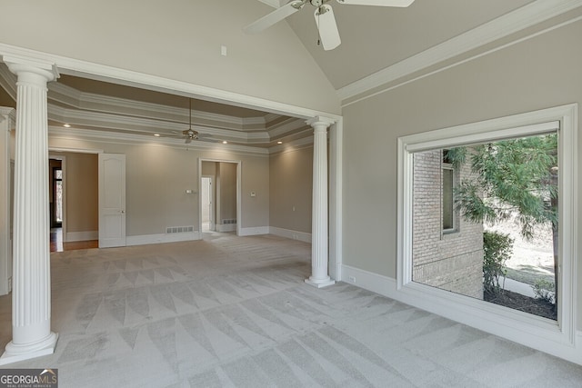 unfurnished room with ornamental molding, decorative columns, ceiling fan, and high vaulted ceiling