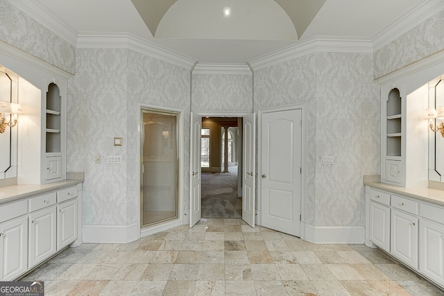 bathroom with ornamental molding, tile flooring, built in features, and vanity