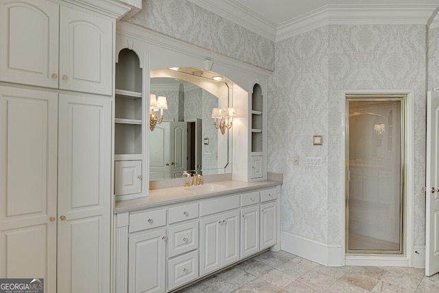 bathroom with walk in shower, tile flooring, vanity, and crown molding