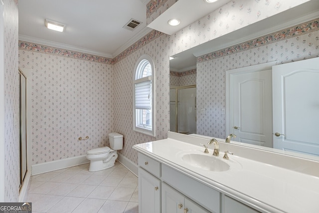 bathroom with tile floors, vanity with extensive cabinet space, toilet, and ornamental molding